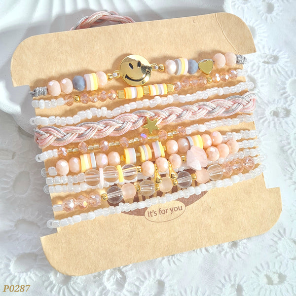 Set de pulseras rosa pastel con cara feliz P0287