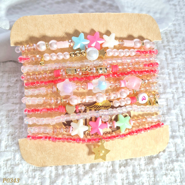 Set de pulseras en tonos rosados P0343