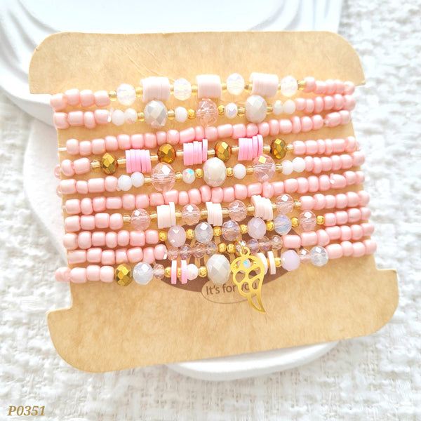 Set de pulseras en tonos rosados y ala P0351