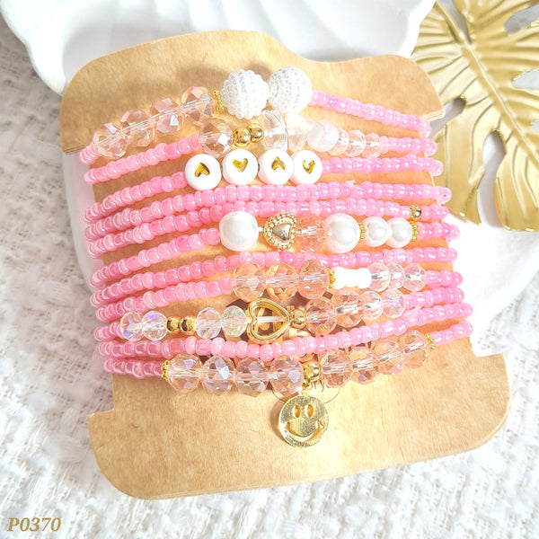 Set de pulseras en tonos rosados P0370
