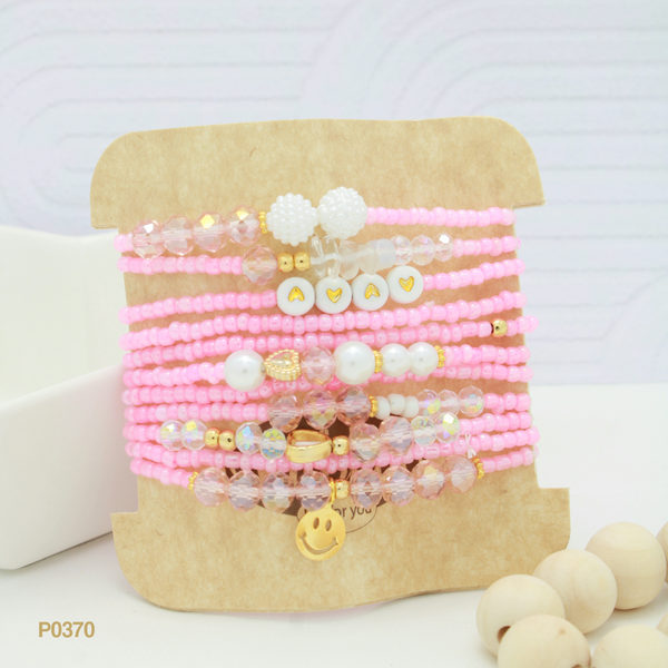 Set de pulseras en tonos rosados P0370