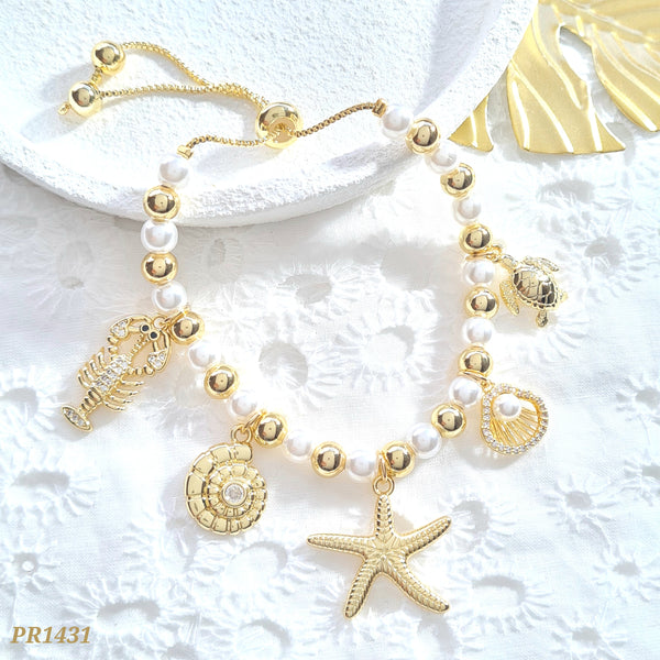 Pulsera perlas, balines y dijes de mar PR1431