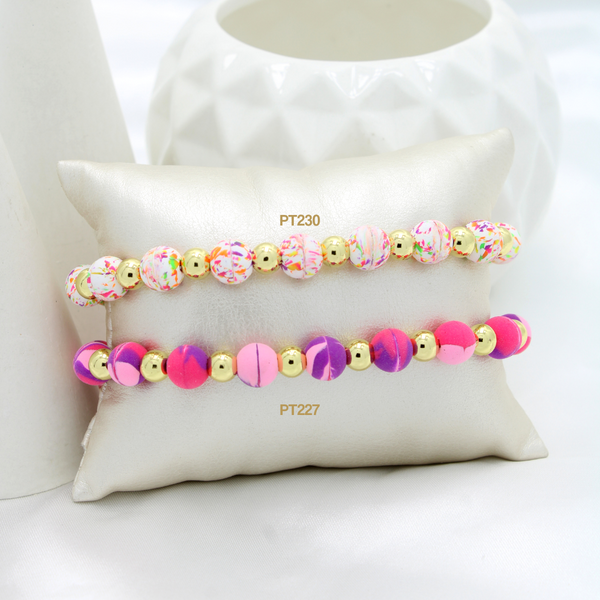 Pulsera multicolor / Pulsera fucsia-morado (cada una)