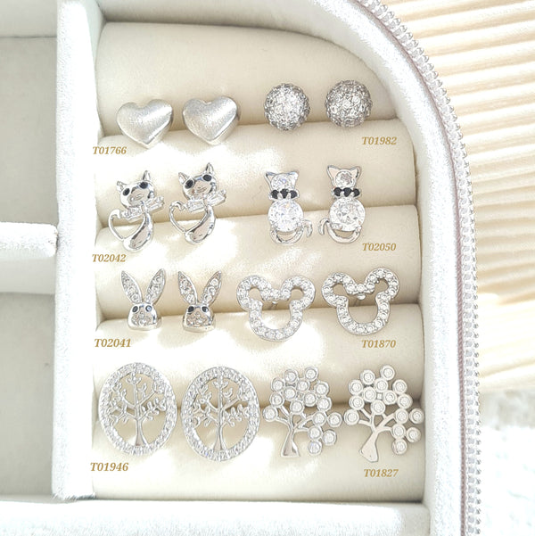 Topos plateados con zircones