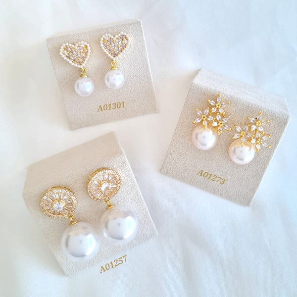 Aretes con perlas y zircones